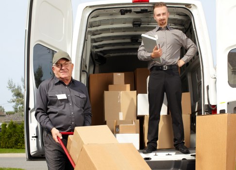Moving trucks ready for relocation in Holland Park