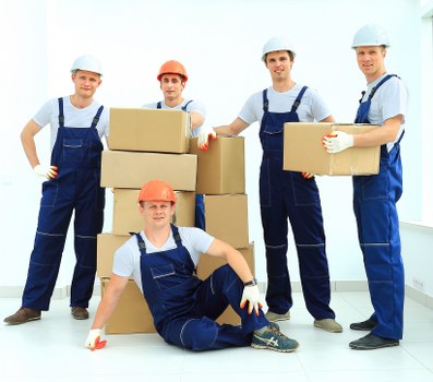 Experienced movers handling furniture in Holland Park