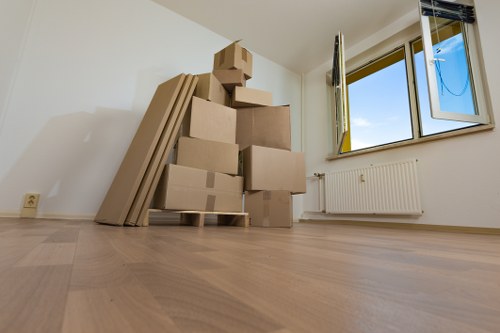 Professional furniture pick-up team at Holland Park storage facility